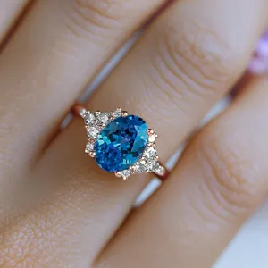 Exquisite oval blue gemstone ring with sparkling side stones, elegant rose gold finish detail.