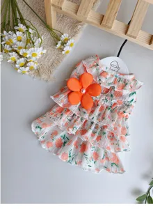 Blumiges Welpenkleid mit Rüschen und großer orangefarbener Blume für kleine Hunde Sommerkleidung