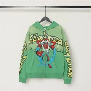 Vintage washed green zip-up hoodie featuring graphic cartoon print and graffiti text.