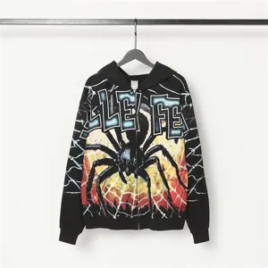 Black zip-up hoodie featuring striking spider graphic and bold streetwear typography design.