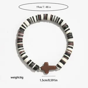 Bracelet de perles d'argile croix style bohème avec perles noir et blanc élastiques.