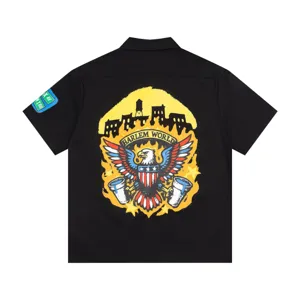 Streetwear black short sleeve camp collar shirt with cool back graphic and sleeve patch.