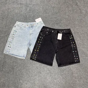 Stylish denim shorts for men and women featuring colorful rhinestone flower studs and wash design.