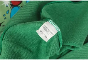 Green cotton hoodie fabric detail shot showcasing texture, stitching and woven label.