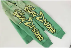 Green gradient hoodie sleeve detail featuring stylish Valley Dreams graphic print design.