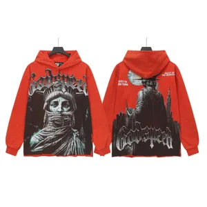 Vintage washed red streetwear hoodie detail featuring Statue of Liberty graphic print.
