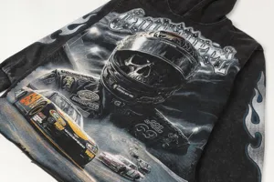 Vintage washed black streetwear hoodie featuring cool racing skull graphic and bold letter prints.