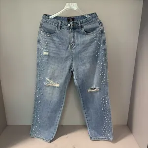 Rhinestone embellished distressed wash jeans, high street vintage style light blue denim trousers.