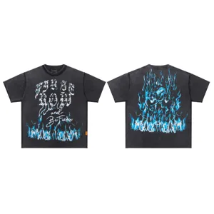 Vintage wash short sleeve t-shirt detail showing back skull graphic and front flame print.