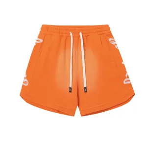 Pantaloncini casual streetwear arancioni con coulisse bianca e ricamo per uomini e donne.
