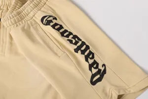 Pantaloni corti casual vintage da strada con ricamo gotico, vita elastica unisex.