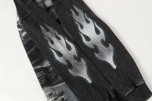 Detailed black washed streetwear hoodie featuring silver flame sleeves and graphic print.