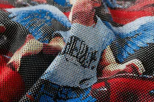 Close-up detail of the graphic printed fabric featuring a retro pop art halftone dot pattern.