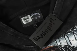 Black washed streetwear hoodie with brand label and hangtag, premium cotton fabric, size L.
