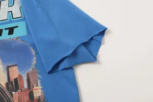 Blue washed streetwear short sleeve t-shirt with retro city graphic and rhinestone letters.