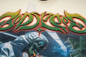 Streetwear skull graphic rhinestone t-shirt detail, premium casual apparel fabric.