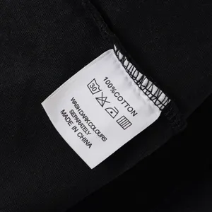 Close-up detail of the garment wash label showing 100% cotton material and instructions.