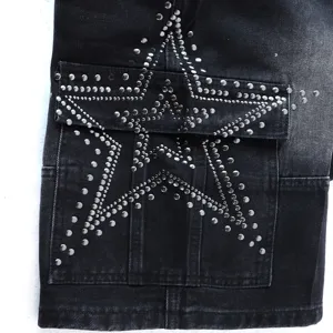 Black denim shorts detail showcasing metallic stud pentagram design and multi-pocket streetwear style