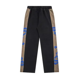 Streetwear casual sweatpants for men and women, featuring colorblock design and side graphics.