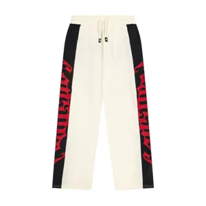 Unisex high street fashion color-blocked sweatpants with red embroidered logo details.