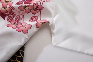 Detailed view of Japanese vintage cherry blossom floral printed fabric material texture.