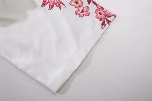 Detailed view of Japanese style floral print cardigan sleeve showing pink cherry blossoms.