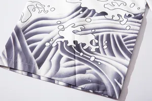 Detail view of Japanese ukiyo-e wave pattern, showing fabric texture and black-white print.