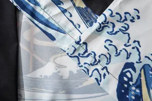 Close-up view of Japanese ukiyo-e wave fabric detail, showing fine stitching and print.