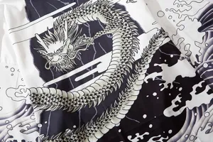 Detail view of Japanese ukiyo-e dragon and wave pattern print loose cardigan kimono shirt.