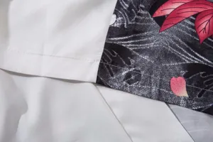 Close up of fabric and stitching detail for Japanese ukiyo-e style retro cardigan shirt.