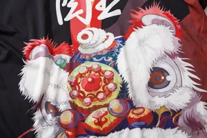 Detailed view of traditional Chinese lion dance print fabric for Japanese retro cardigans.