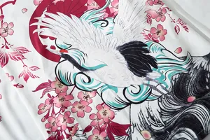 Detail shot of Japanese ukiyo-e crane and cherry blossom printed fabric, vintage style.