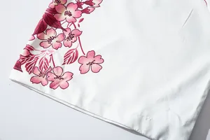 Japanese style kimono cardigan fabric detail white fabric with pink cherry blossom pattern print.
