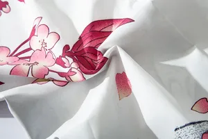 Close-up detail view of Japanese style floral fabric featuring delicate pink cherry blossom print.