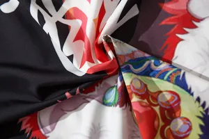 Fabric detail of Japanese style anime print cardigan shirt, showcasing vibrant colors and soft texture.