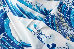 Detailed close-up view of Japanese ukiyo-e wave print fabric with fine textile textures.