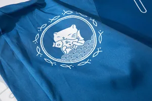 Detailed view of the dark blue Japanese style haori cardigan fabric and the cute cat print.