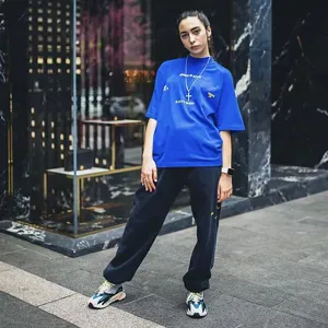 Casual blue short sleeve t-shirt with letter print, comfortable loose fit streetwear for men and women.