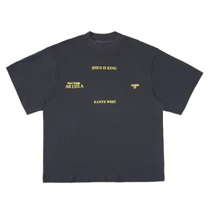 Close-up of streetwear graphic t-shirt with bold yellow typography printing on chest front.