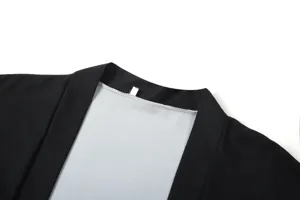 Detailed close-up view of the black Japanese kimono cardigan collar and stitching.