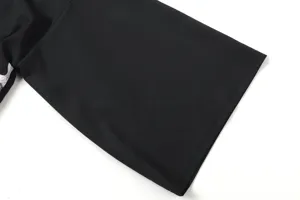 Black fabric sleeve detail shot showcasing fine stitching and smooth texture for apparel.