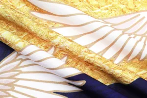 Close-up detail of Japanese kimono fabric texture, intricate gold and blue ukiyo-e print.