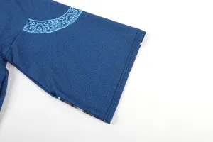 Detailed view of blue traditional swirling pattern kimono sleeve fabric and stylish design edge.