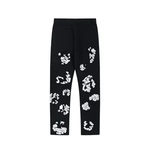 Detailed back view of mens womens high street washed denim pants with kapok print design.