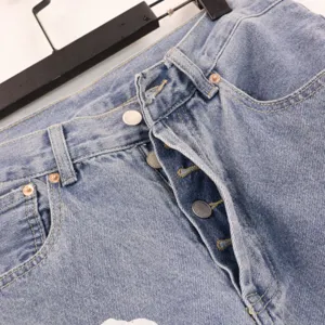 High street washed light blue denim jeans with multi button fly and classic contrast stitching.
