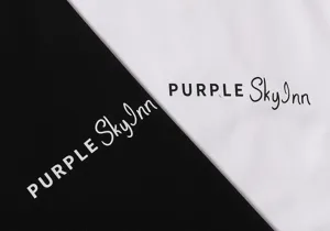 Streetwear t-shirt fabric detail featuring modern letter print in classic black and white.