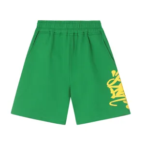 Casual green streetwear shorts with yellow graffiti letter print, comfortable elastic waist.
