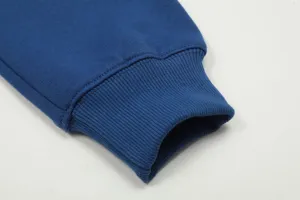 Close-up detail of the deep blue fleece-lined hoodie ribbed cuff, soft texture and cozy.