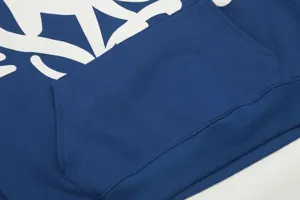 Detailed view of blue fleece hoodie kangaroo pocket and ribbed hem streetwear fashion essential.