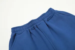 Close-up detail shot of blue casual athletic sweatshorts waistband with elastic design.